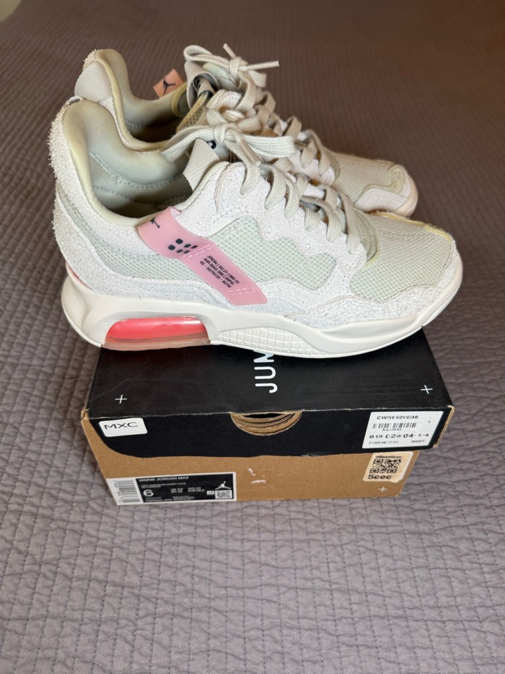 Jordan Women’s Cream Sneakers with Pink Accents